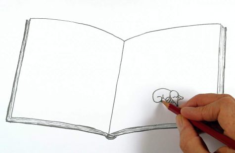 una mano dibuja un perro en un cuaderno.